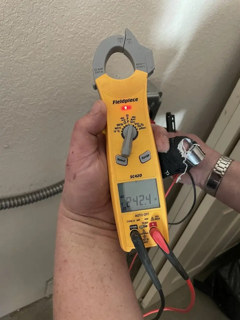 Voltage testing with clamp meter during Electrical Installation Services in Avon Park